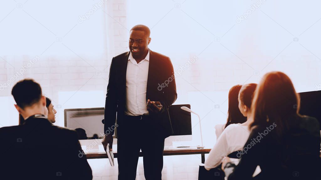 Team of Managers on Business Meeting in Office. Training in Office. Modern Office Concept. Cooperation with Colleagues. Businessman with Team. Team Building on Workplace. Businessman in Suit.
