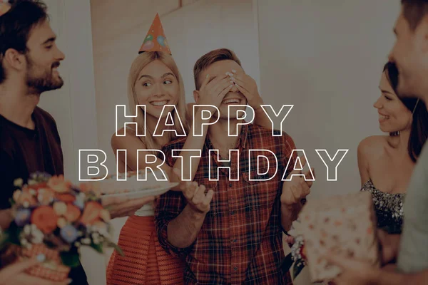 Friends Prepared Surprise. Girl Closed Guy\'s Eyes by Hands. Birthday Boy Smiles. Woman Leads to Man Surprise Party. Happy Birthday Celebration. Girl in Birthday Hat. Best Friends Happy Together.