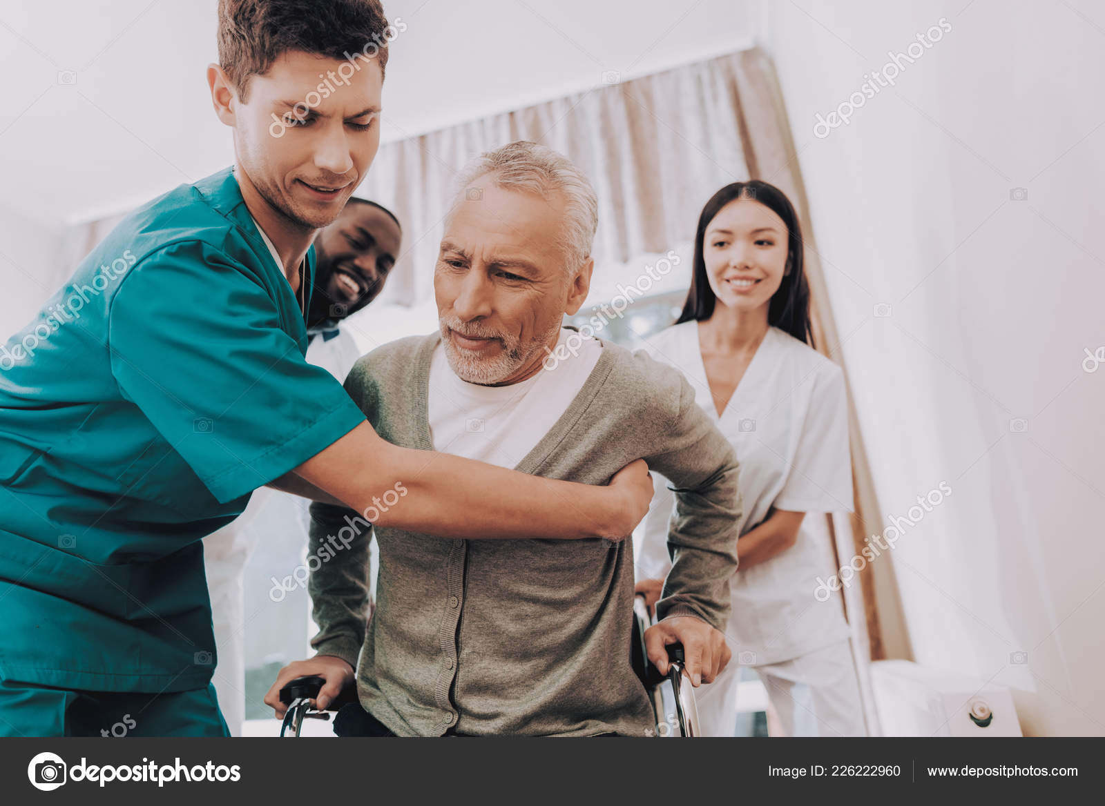 Doctor Helps Patient Get Patient Wheelchair Male Get Out Bed Stock