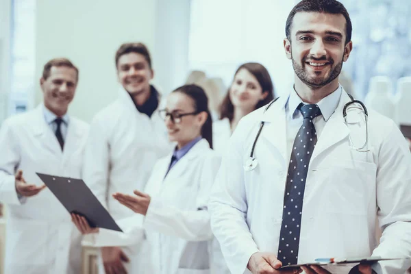 Male Pharmacist Stethoscope Smiling Man Looking Camera Other Pharmacists Working — Stock Photo, Image