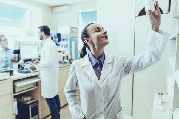 Pharmacists Working Counter Man Buys Mineral Water Male Pharmacist Female — Stock Photo, Image