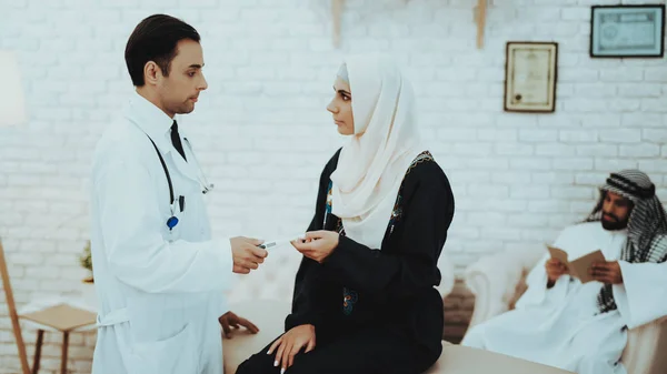 Muslim Woman Holding Pregnancy Test in Hospital. Pregnancy Woman. Gynecologist Concept. Motherhood. Arabic Woman Wearing Hijab in Hospital. Ultrasound Concept. Pregnancy Test Concept.