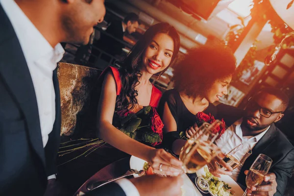 Group Happy Friends Enjoying Dating in Restaurant. Double Couple Dating in Restaurant. Romantic Couple in Love Dating. Friends in a Restaurant Making Order. Romantic Concept. Pouring Glasses Wine