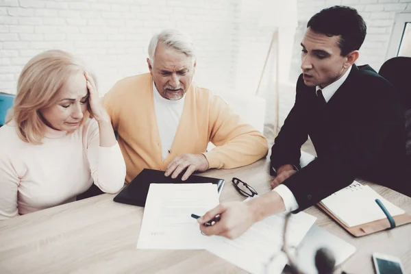 Old Man and Woman Visiting Young Lawyer in Office. Important Documents. Modern Law Office. Grandfather and Grandmother. People with Gray Hair. Young Advocate. Justice and Law Concepts.