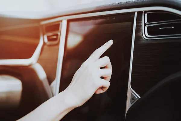 Woman In Tesla Car. Behind The Wheel Concept. Innovation Technology. New Generation Electro Hybrid Vehicle. Luxury Design. Futuristic Power. Hand On Display. Inside View. Front Seat.