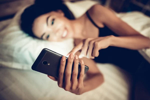 Girl Texting on Mobile Phone in Low Light.