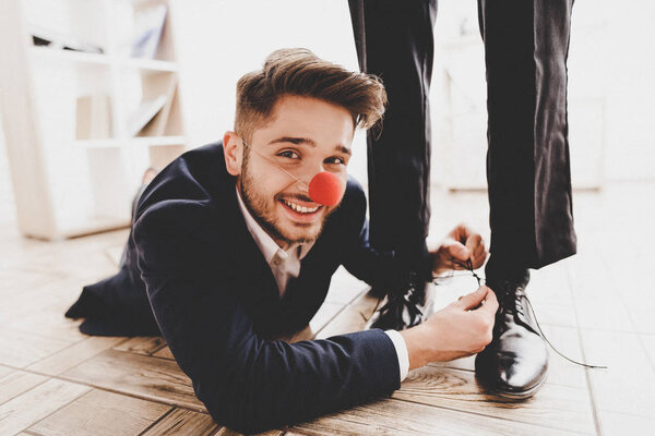 Man Lying Floor Tying Colleague Shoelaces Business Meeting Office April Stock Image