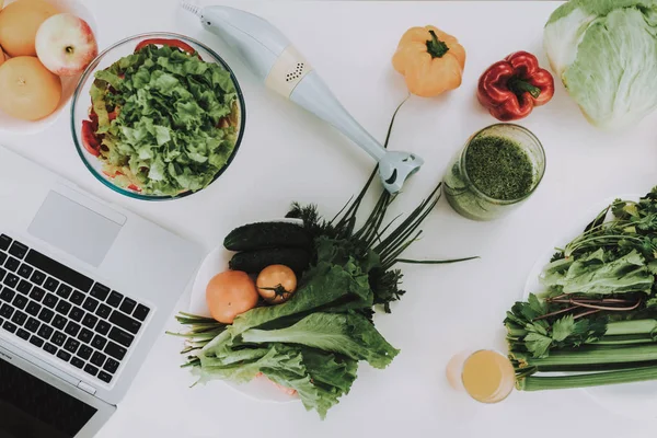 Close Up. Food And A Mixer On Kitchen Table. Fresh Healthy Food Nutrition Concept. Ready To Cook. Electric Kitchenware. Vegetarian Meal On A Plate. Fruits And Vegetables. Cocktail Of Vitamins.