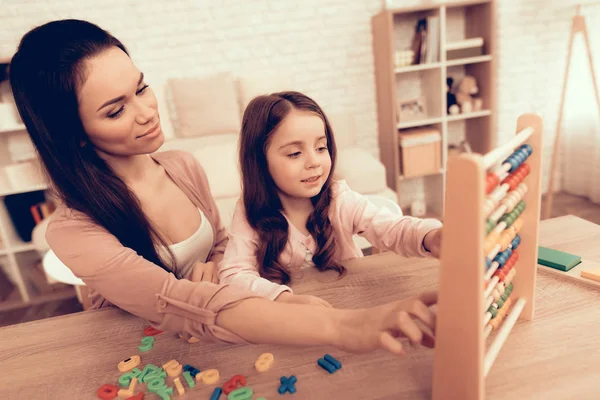 Woman with Board Game Teaches Child at Home. — Stock Photo, Image