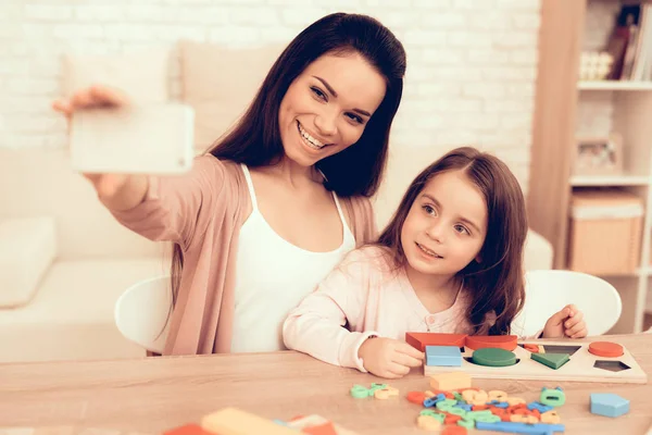 Happy Woman and Girl Take Selfie with Board Game. — Stock Photo, Image