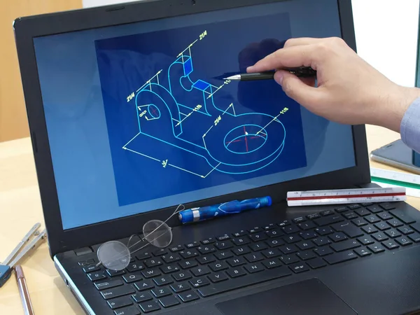 engineer working at laptop computer on cad mechanical piece design