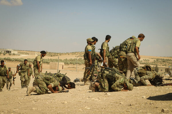 Aleppo, Syria 29 June 2017: Soldiers collectively pray in the army