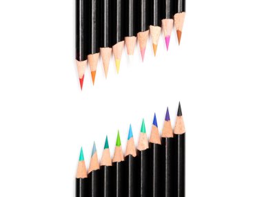 Multicolor pencils with warm colors leads at the top and cold colors leads below make diagonal free space on white background, close up