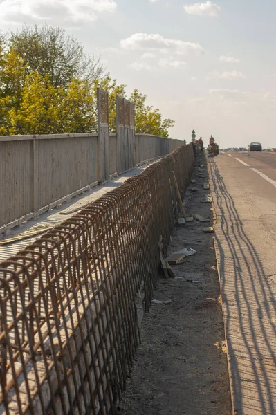 Bridge repair. Welding machine. Welders work on the bridge. Armature frame