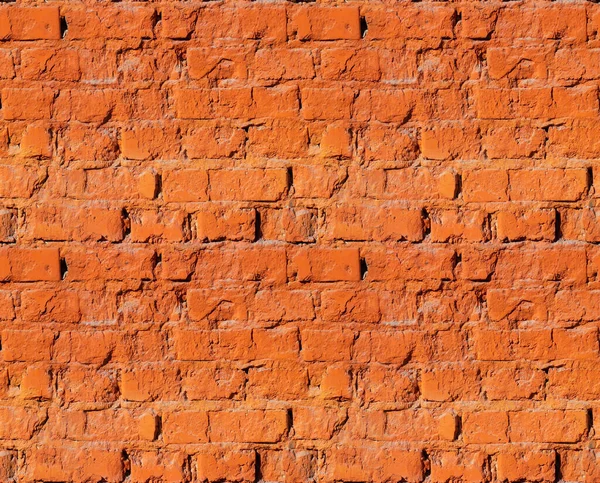 Seamless pattern. The texture of the old broken brick. Copper color.