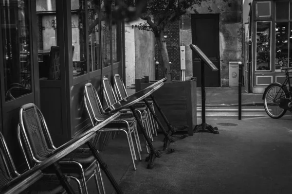 Empty street restaurant terrace, Paris