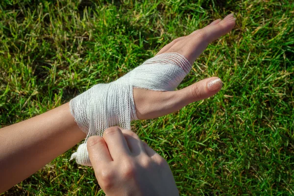 Girl Hands Independently Apply Antibacterial Medical Bandage Her Wrist Falling — Stock Photo, Image