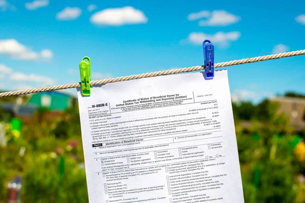 The documents (tax forms) were washed and dried in the open air by hanging from a clothesline. Concepts of money laundering, legalization of income, concealment of income, tax evasion.