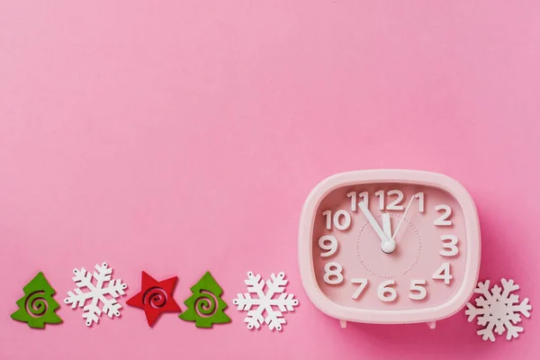 Pink Alarm Clock Toys Snowflakes Lying Pink Surface Background New — Stock Photo, Image
