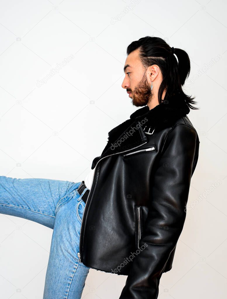 attractive male model with a leather jacket posing