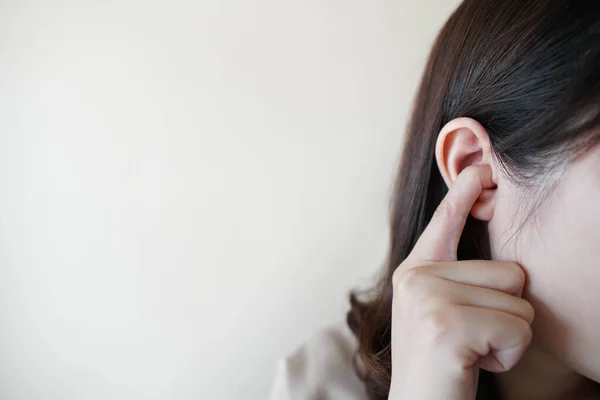 Young Woman Sticking Plug Fingers Ears Listening Loud Sound White — Stock Photo, Image