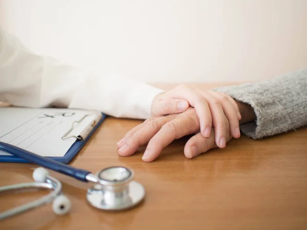 Female Doctor Holding Middle Aged Patient Hands Comforting Encouragement Hospital — Stock Photo, Image