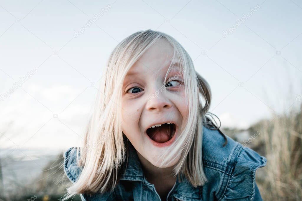Young girl doing a funny face