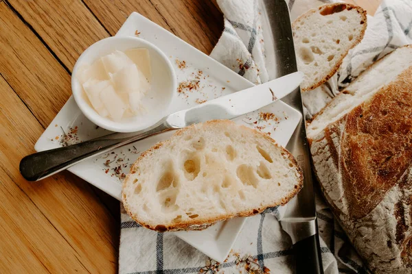 crumb, carbohydrates, baker bread, lunch, kitchen table, authentic, closeup, buttered, crusty, loaf of bread, sourdough on wooden table, artisan bakery, freshly baked, sourdough loaf, artisan bread, sliced, wooden, sourdough bread, toast, spread, bak