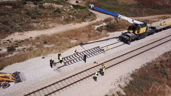 Railroad workers repairing a broken track. Repairing railway. Rail tracks maintenance process. — Stock Photo, Image