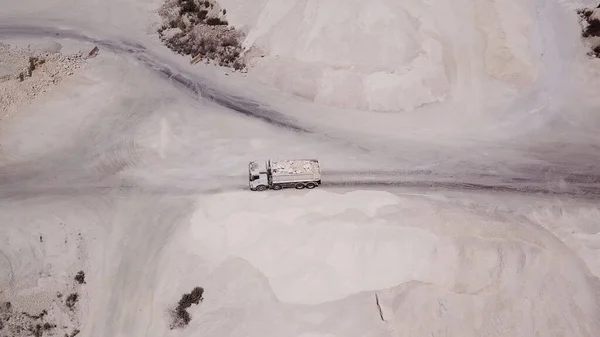 Aerial view on a truck loaded with lime at quarry factory. — Stock Photo, Image