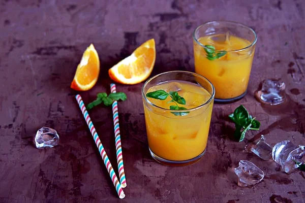 Refreshing Drink Orange Cocktail Basil Glasses Served Ice Cubes Straw — Stock Photo, Image