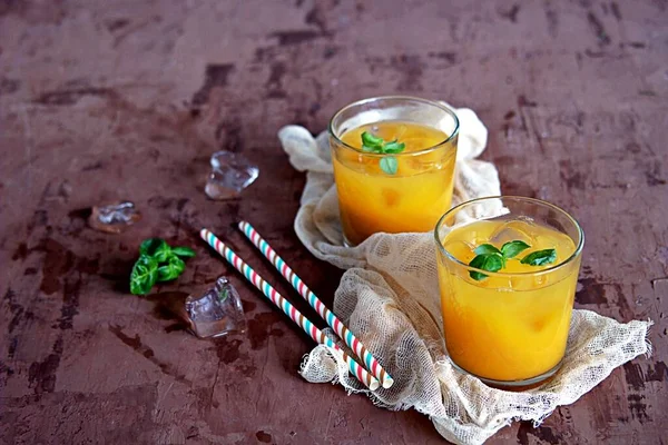 Refreshing Drink Orange Juice Basil Glasses Served Ice Cubes Straw — Stock Photo, Image