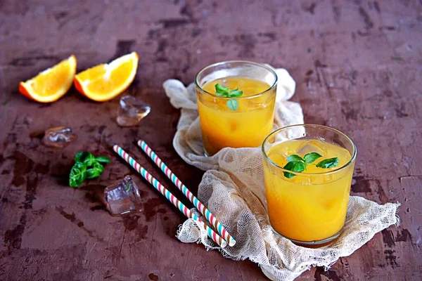 Refreshing Drink Orange Juice Basil Glasses Served Ice Cubes Straw — Stock Photo, Image