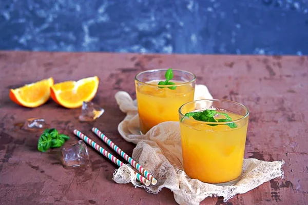Refreshing Drink Orange Juice Basil Glasses Served Ice Cubes Straw — Stock Photo, Image