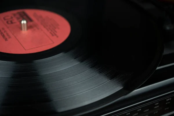 Close up of vintage vinyl with red label on a player