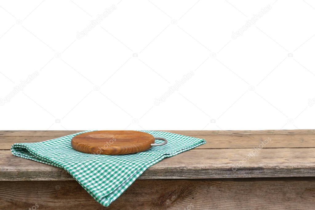 checkered linen kitchen towel and round cutting board on a wooden table template with copy space