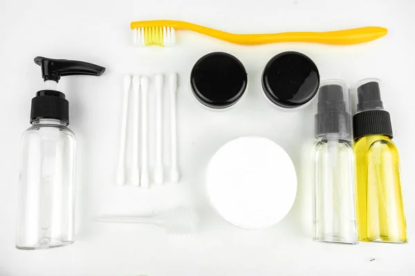 toiletries necessaries set in small bottles for traveling