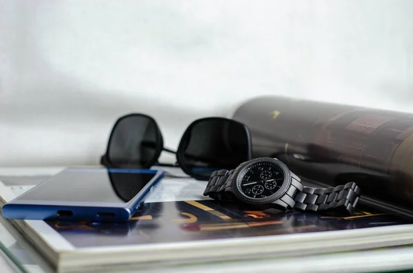 Elegant business unisex fashion no brand wrist watch, smartphone and sunglasses