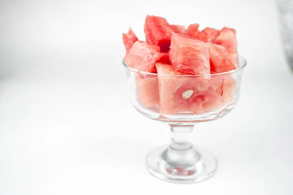 watermelon chopped pieces in a glass cup, summer fruit refreshment