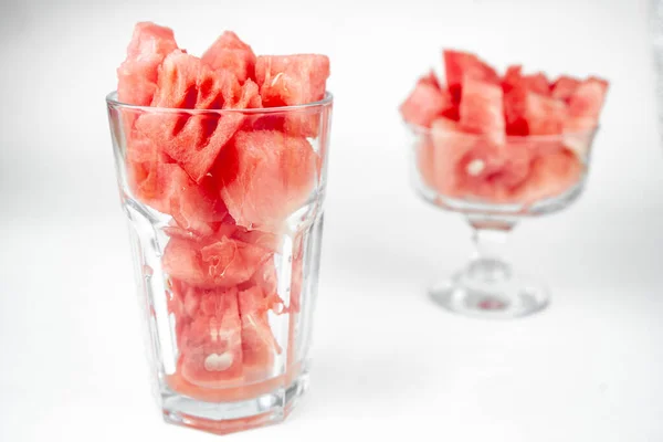 watermelon chopped pieces in a glass cup, summer fruit refreshment