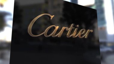 Siyah dış duvardaki Altın Cartier ambleminin 3D animasyonu.