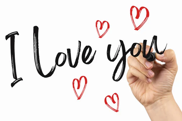 I love you with little hearts. Doodle  on a whiteboard, written with black marker in a hand. Scribble sketch text on a white board