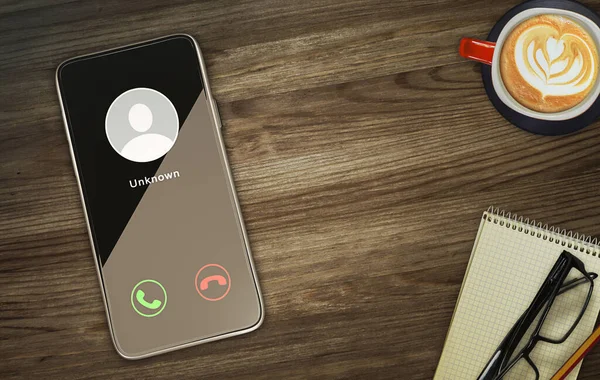 Unknown caller telephony concept. incoming call at a flat lay mobile phone on a wooden desk
