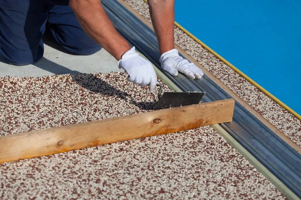 Worker Places Stone Carpet Resin — Stock Photo, Image