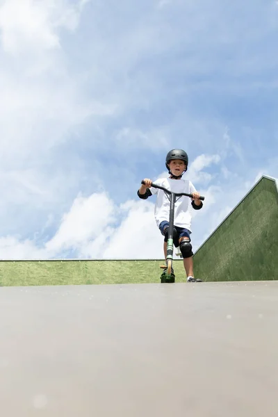 Cute Little Boy Rides Scooter Skatepark Young Novice Athlete Spends — Stock Photo, Image