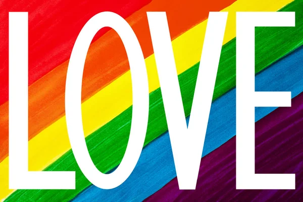 白い単語の愛虹色の背景に閉じ Lgbtコミュニティフラグバナー Lgbtqの誇りポスター 手紙の愛のサイン レズビアン バイセクシャルなどのシンボル トレンディーな水彩壁紙のデザイン — ストック写真
