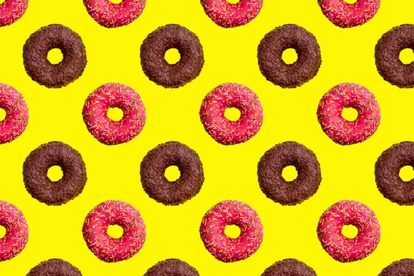 Pattern of pink and chocolate donuts on bright yellow background top view, tasty doughnuts backdrop, colorful sweet dessert wallpaper, repeating decorative ornament, delicious cakes flat lay