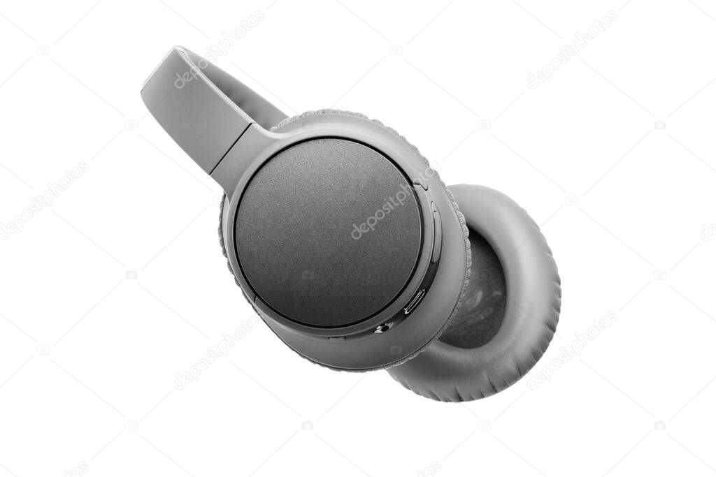 Gray wireless headphones on white background isolated close up, grey bluetooth headset with big leather ear pad cushions design, modern black wi-fi stereo sound earphones side view, audio music device