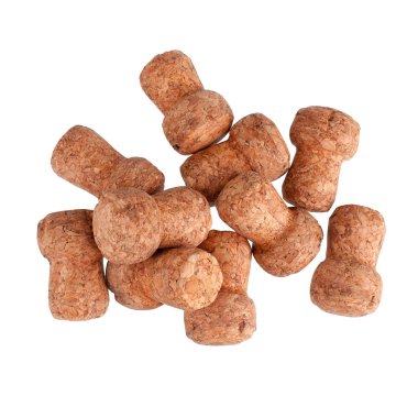 Şampanyadan bir yığın mantar ya da beyaz arka planda köpüklü şarap. Yakın çekim stüdyo çekimi.