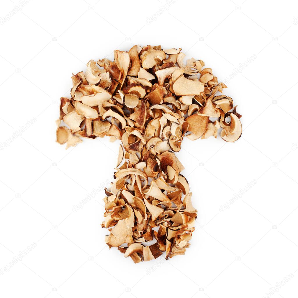 Edible dried mushrooms in shape of mushroom silhouette white background isolated close up top view, dry boletus edulis heap, brown cap boletus, sliced penny bun, cep, porcino or porcini, white fungus